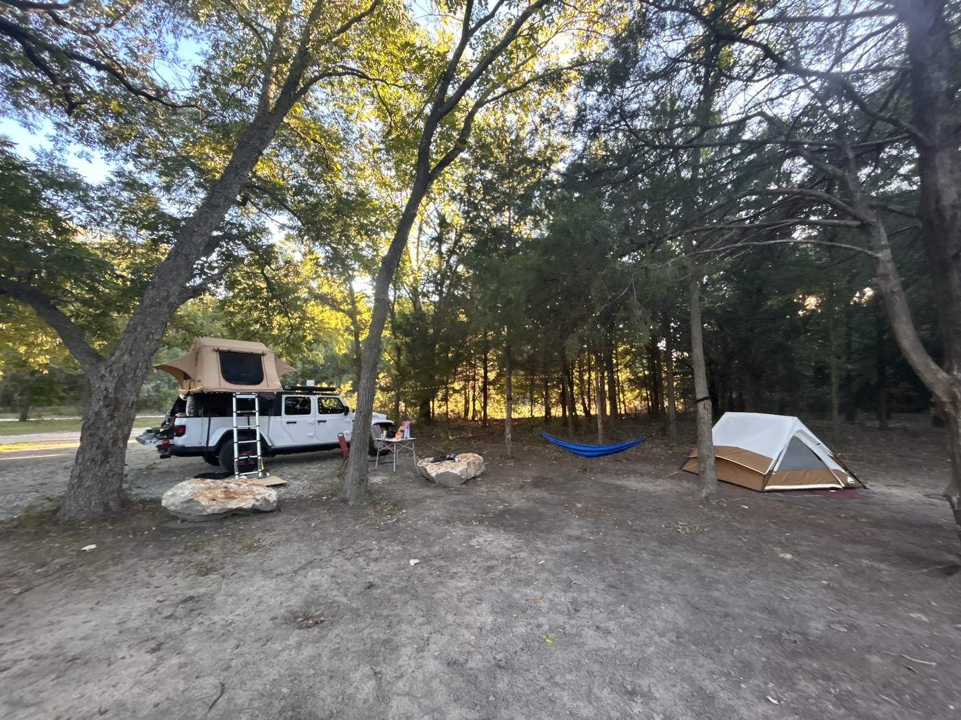 Our camp: Jeep with rooftop tent, hammock and tent in the trees